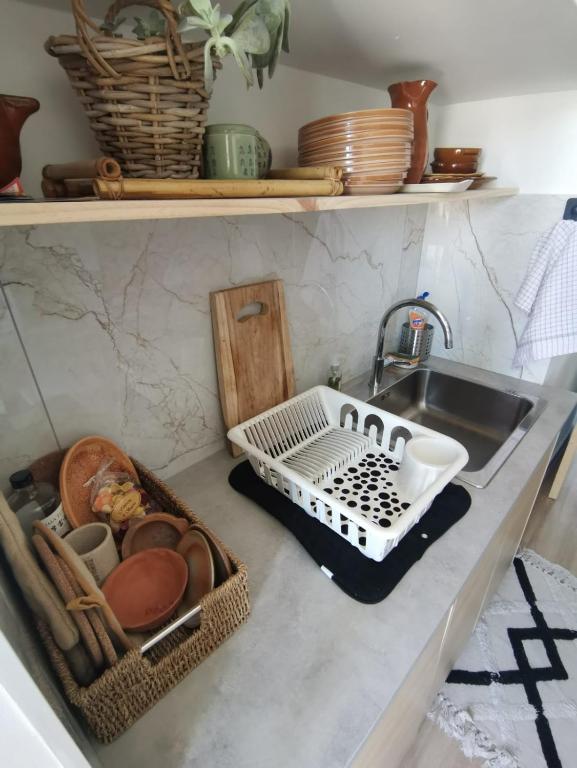 a kitchen counter with a sink and a tray with dishes at Massilia Calling love Appartement de standing 8 personnes Marseille proche métro parking facile in Marseille