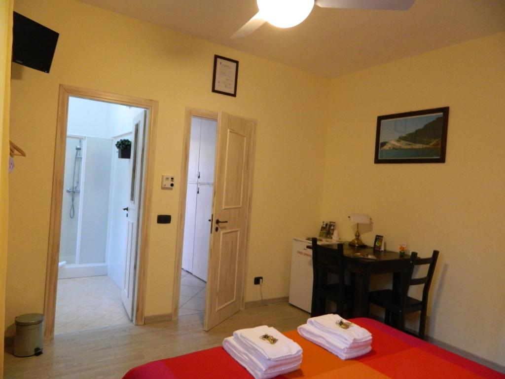 Postel nebo postele na pokoji v ubytování B&B San Leone