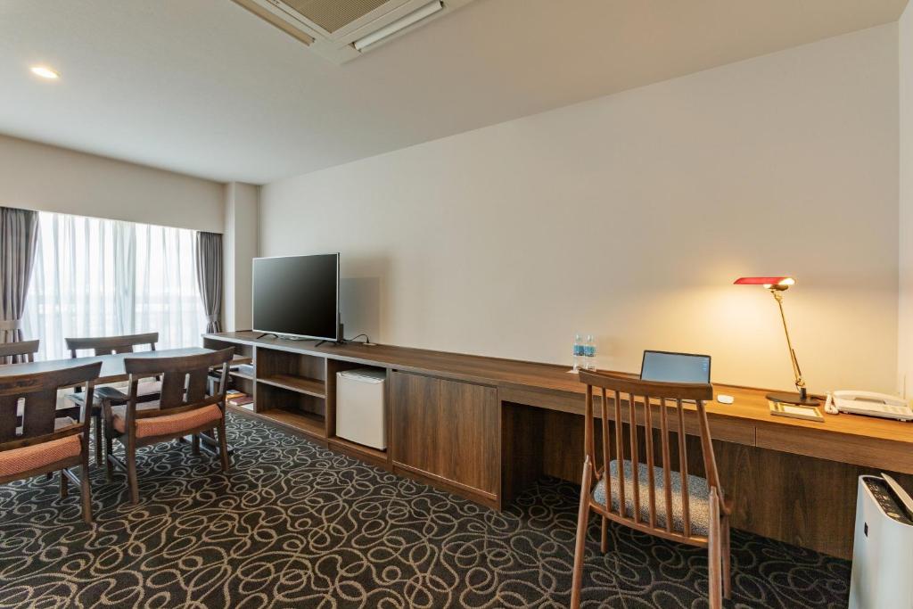 TV a/nebo společenská místnost v ubytování Suikouen Hotel