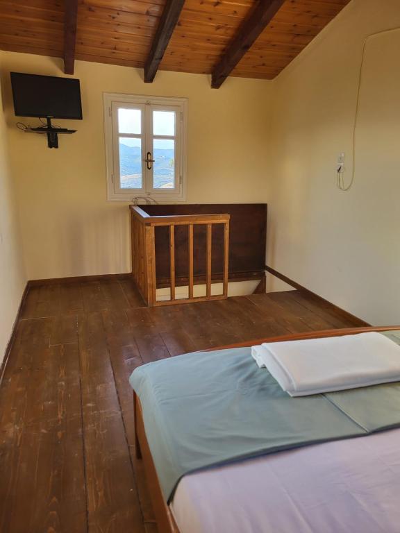 Postel nebo postele na pokoji v ubytování Mani Hill House