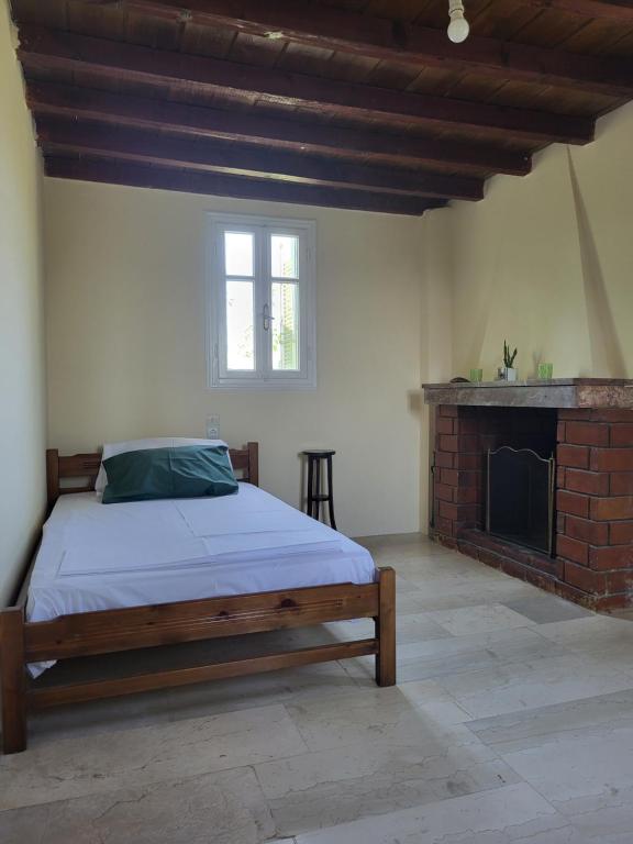 Postel nebo postele na pokoji v ubytování Mani Hill House