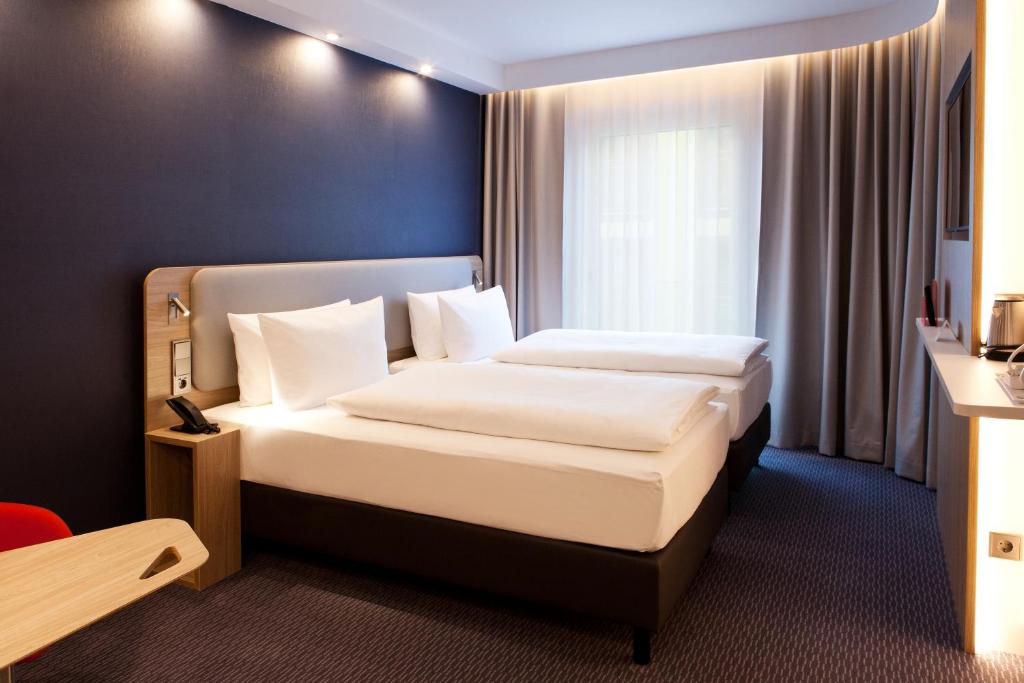 Postel nebo postele na pokoji v ubytování Holiday Inn Express Bochum by IHG