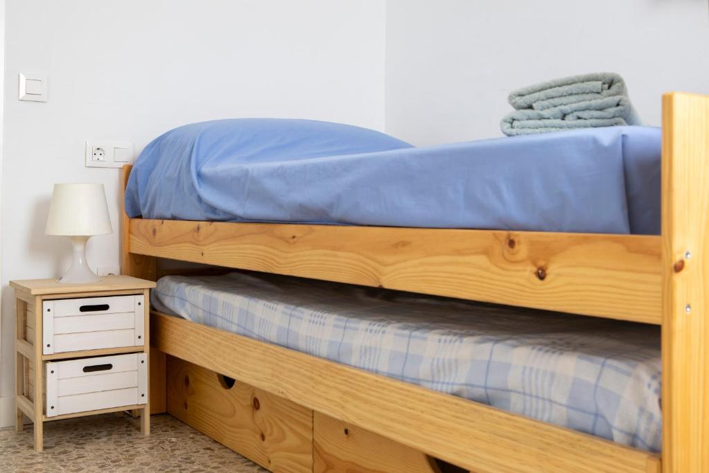 Posteľ alebo postele v izbe v ubytovaní Apartamento Málaga El Faro