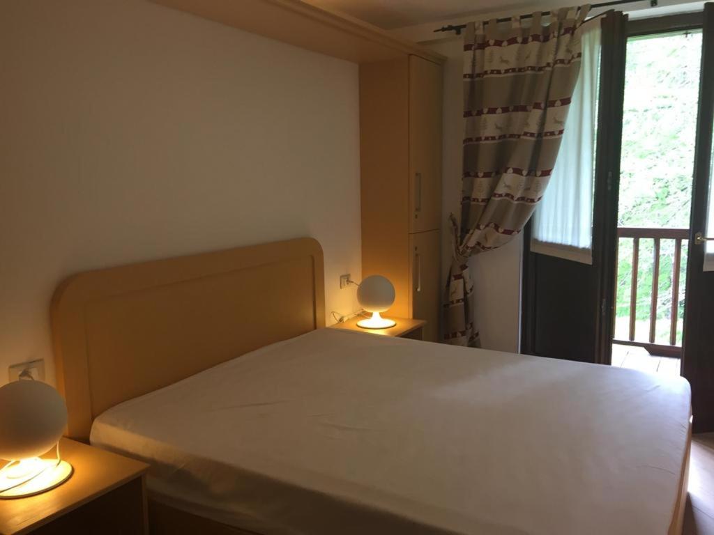 Postel nebo postele na pokoji v ubytování Residence Dei Walser