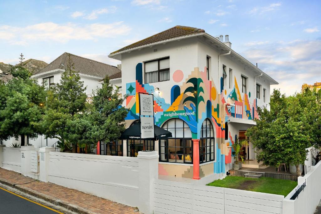 a building with a mural on the side of it at Neighbourgood Hill in Green Point