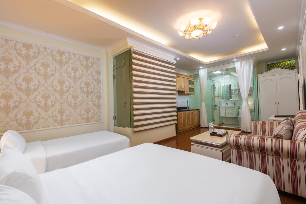 Postel nebo postele na pokoji v ubytování My Moon Hotel Hanoi