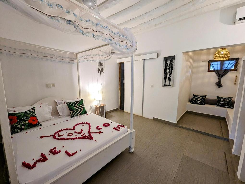 Postel nebo postele na pokoji v ubytování Bahati Villa
