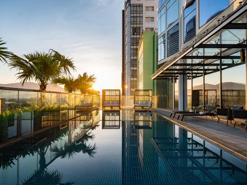 a swimming pool in the middle of a building at Bay Capital Danang in Danang