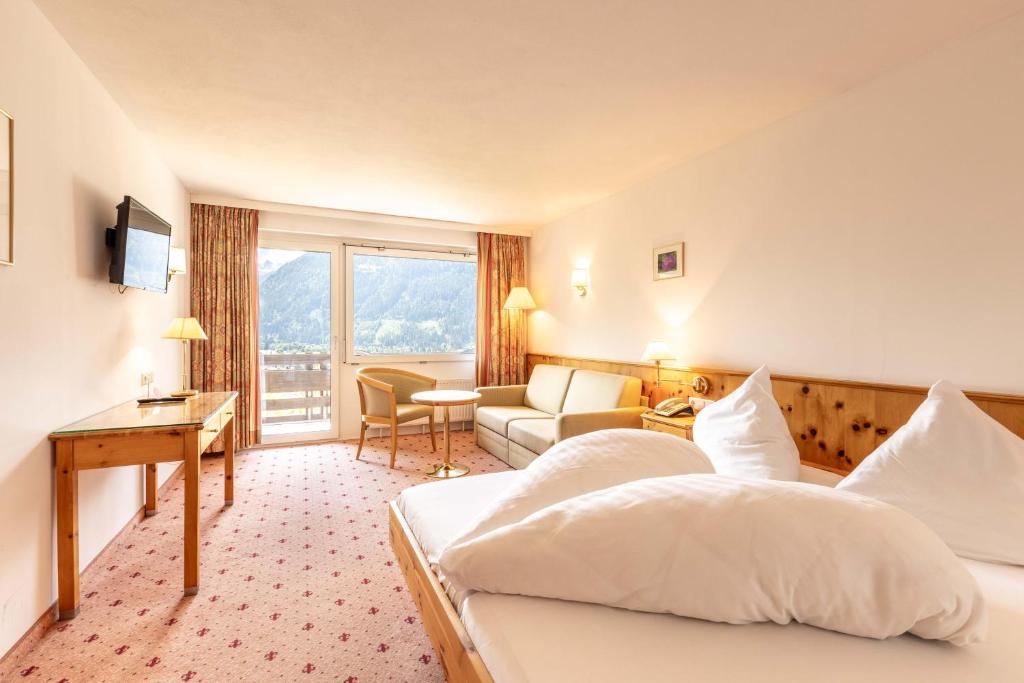 Postel nebo postele na pokoji v ubytování keyone rooms Montafon