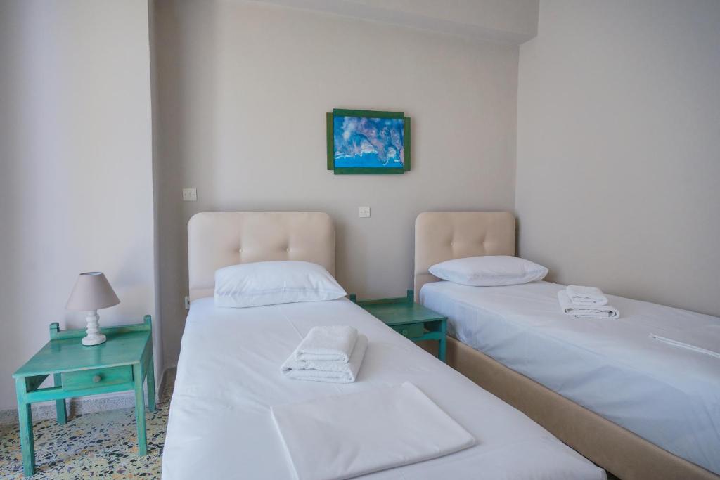 Postel nebo postele na pokoji v ubytování Hotel Korfos - Ξενοδοχείο Κόρφος Renovated