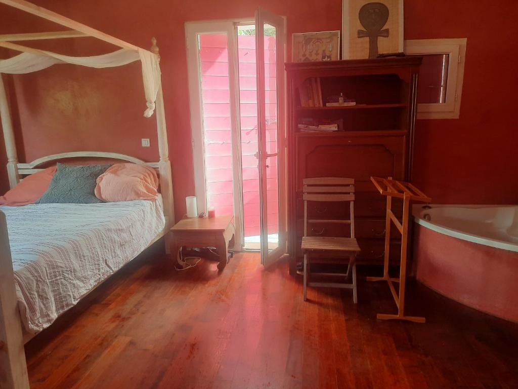 Ένα ή περισσότερα κρεβάτια σε δωμάτιο στο Villa Arcadie