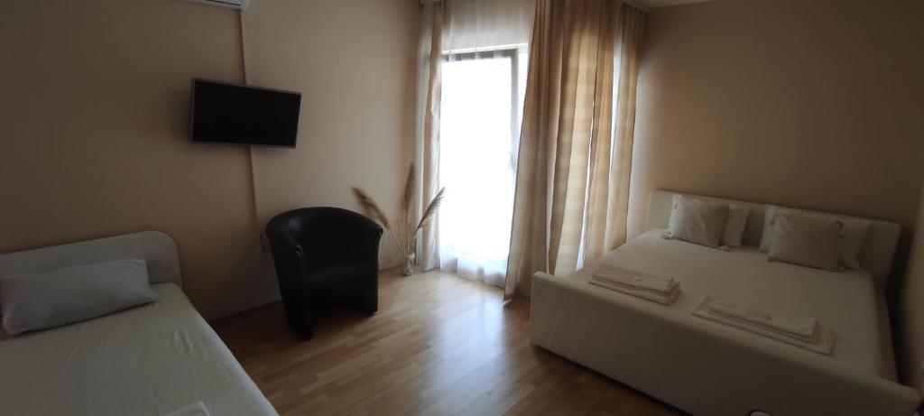 Postel nebo postele na pokoji v ubytování Hotel & Rooms Lombrelle