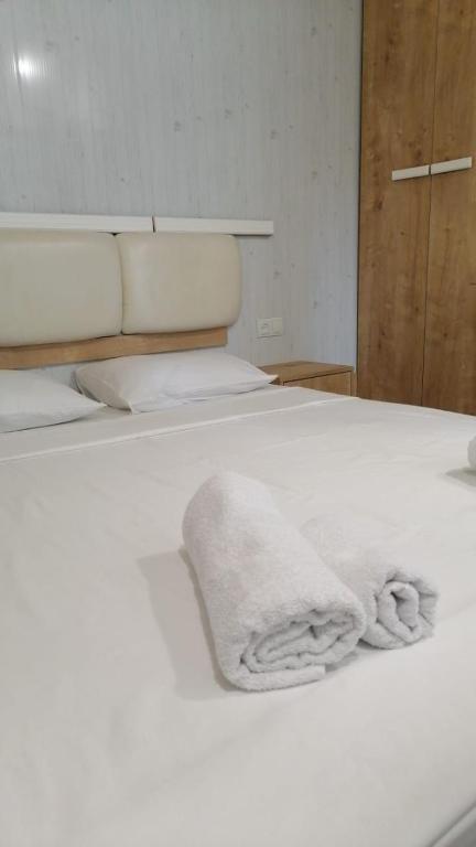 Postel nebo postele na pokoji v ubytování Kai Hotel Bar