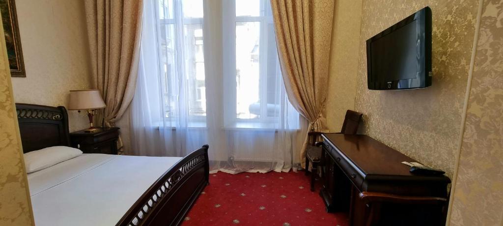 TV a/nebo společenská místnost v ubytování Oreanda Hotel