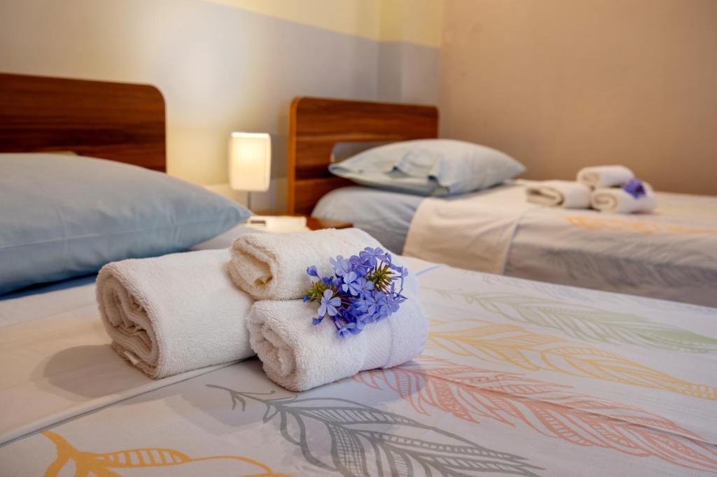 Postel nebo postele na pokoji v ubytování Villa Avgerini Paxos