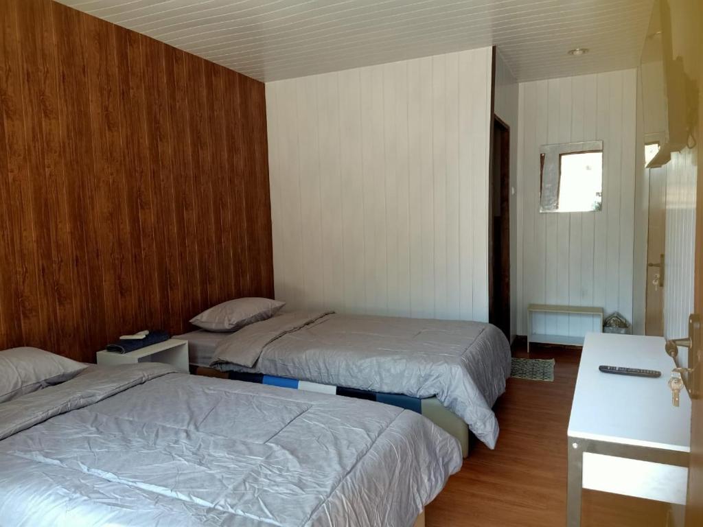 Postel nebo postele na pokoji v ubytování Istana Bromo Resort