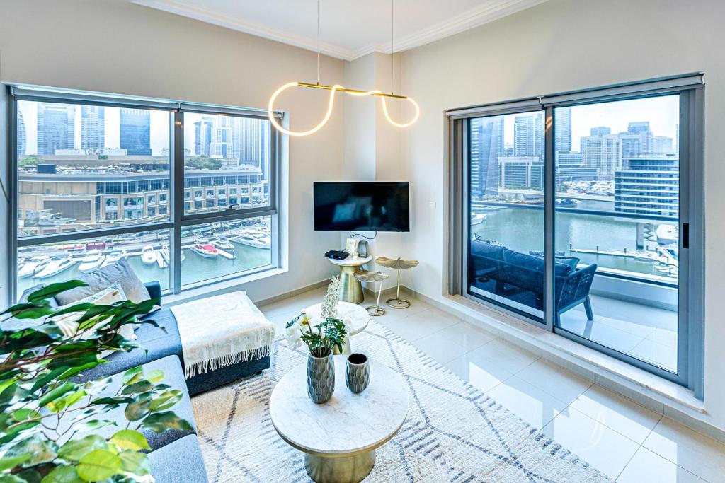 a living room with a view of a city at Bay Central, Dubai Marina in Dubai