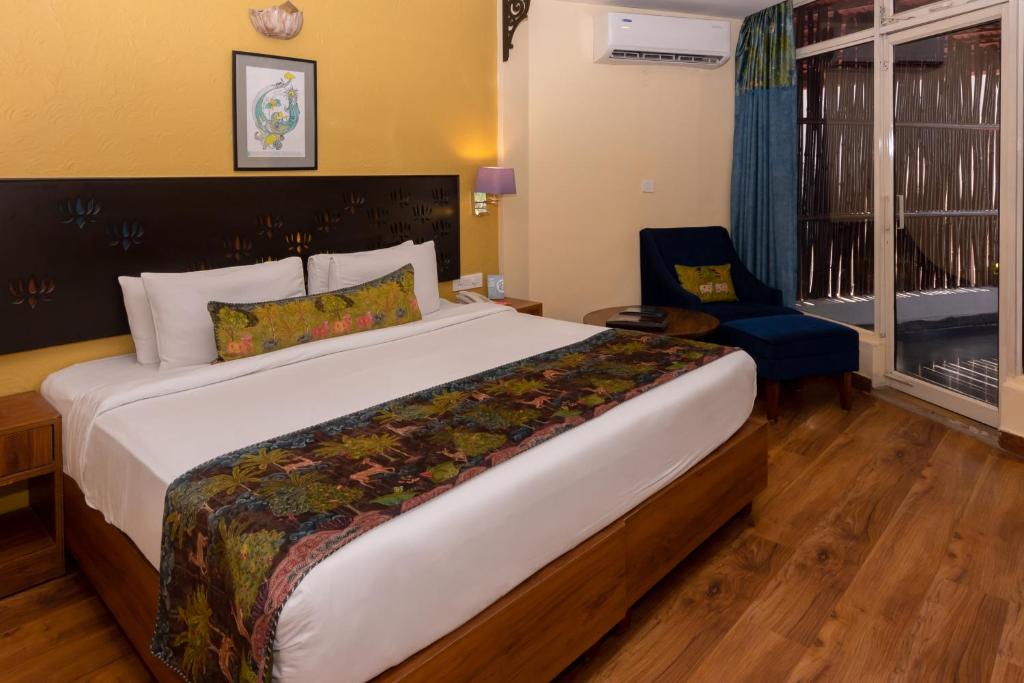 Postel nebo postele na pokoji v ubytování GANGA KINARE- A Riverside Boutique Resort, Rishikesh