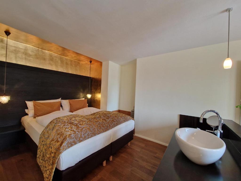 Postel nebo postele na pokoji v ubytování Laurentius Boutique-Hotel & Restaurant
