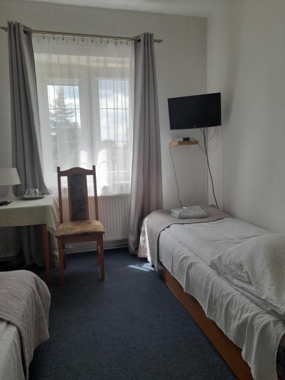 Postel nebo postele na pokoji v ubytování Zajazd nad Wisłą