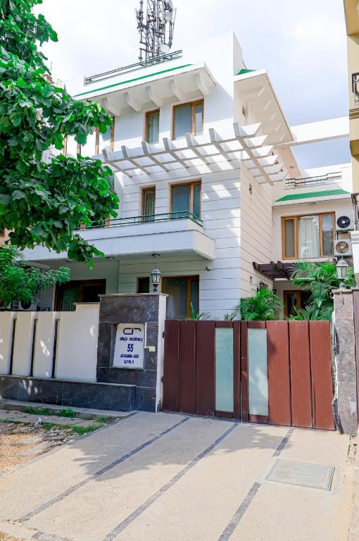 a building with a gate in front of it at Ahuja Residency Cyber City I in Gurgaon