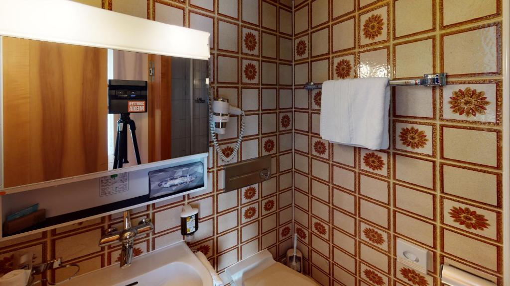 Kuchyň nebo kuchyňský kout v ubytování Hotel Ambassador