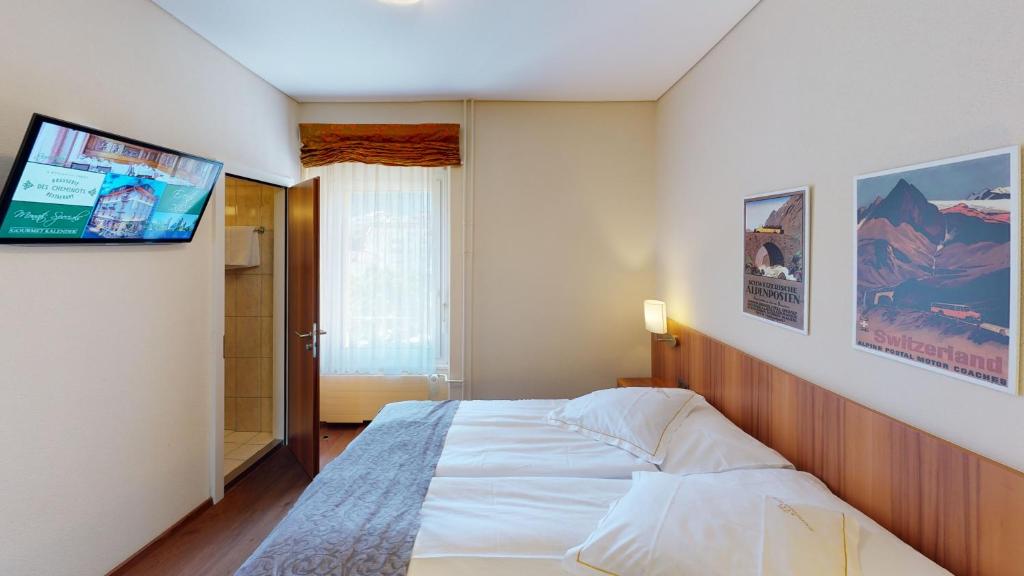 Postel nebo postele na pokoji v ubytování Hotel Ambassador