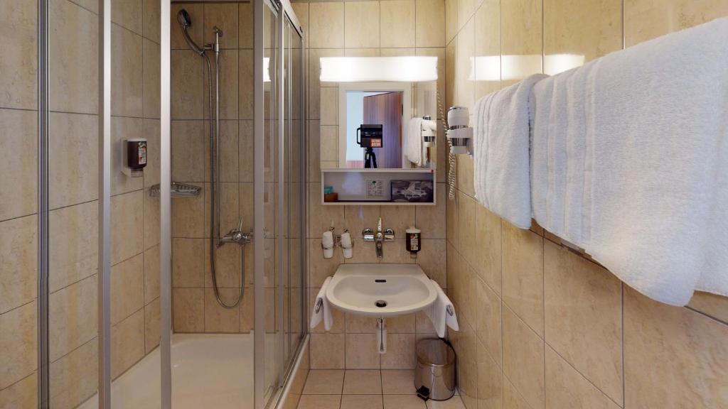 Koupelna v ubytování Hotel Ambassador