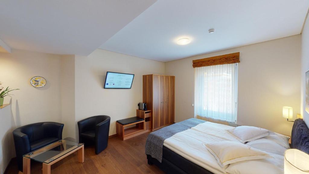 Postel nebo postele na pokoji v ubytování Hotel Ambassador