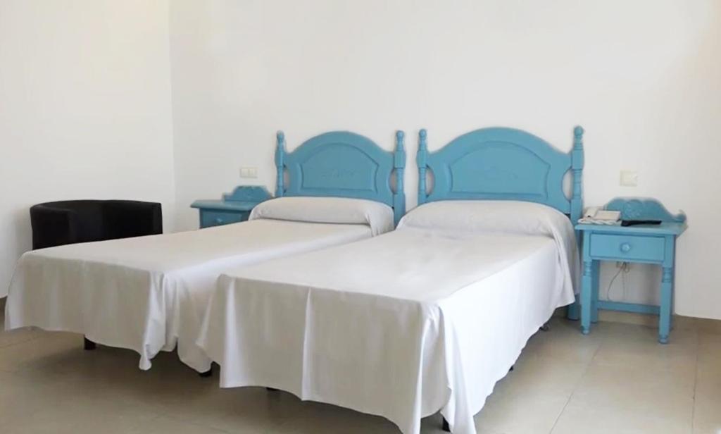 Postel nebo postele na pokoji v ubytování Hotel Eliseos