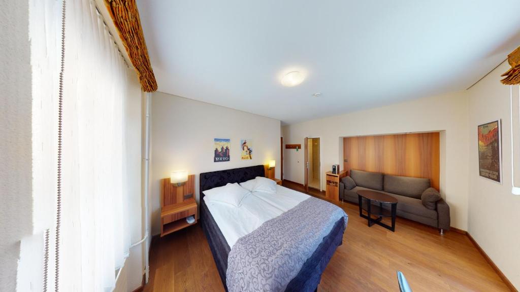 Postel nebo postele na pokoji v ubytování Hotel Ambassador