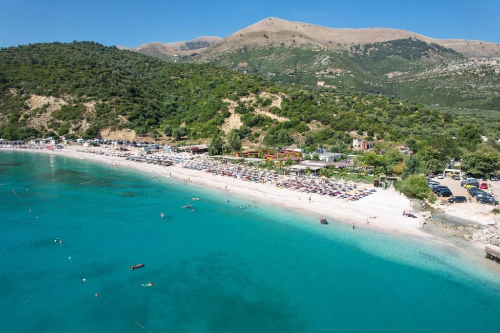 an aerial view of a beach with a crowd of people at Bunec Beach Resort in Piqeras