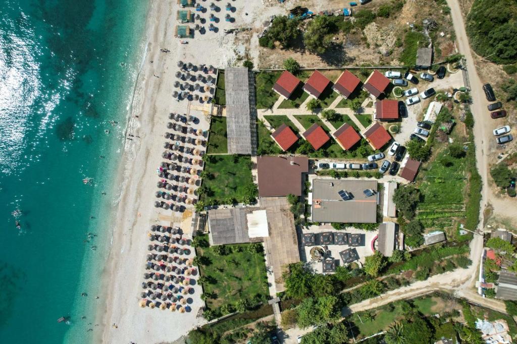 an aerial view of a beach with parked cars at Bunec Beach Resort in Piqeras