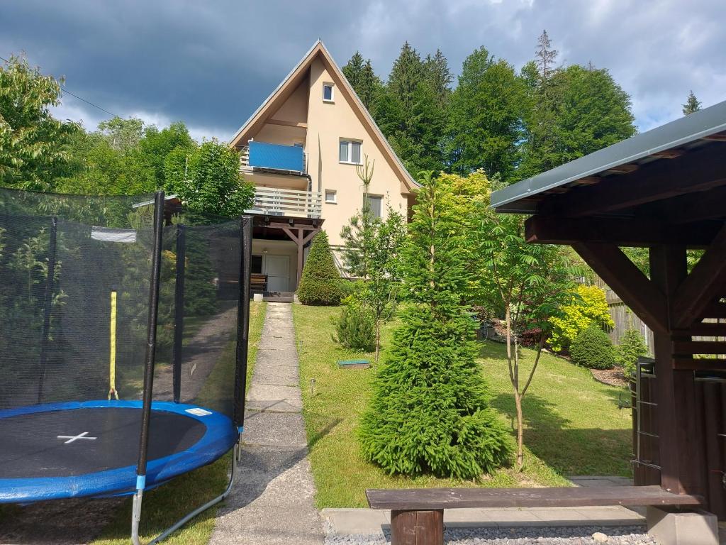 a house with a swimming pool in a yard at Chalupa Varechovsky potok in Vysoká nad Kysucou