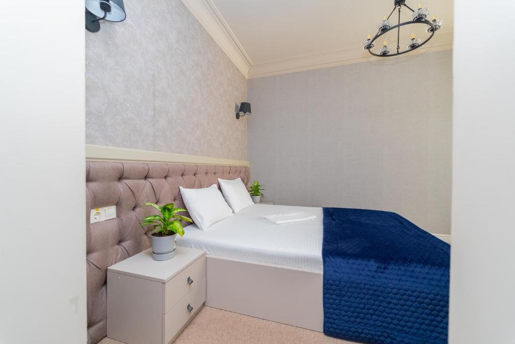 Postel nebo postele na pokoji v ubytování Maner hotel