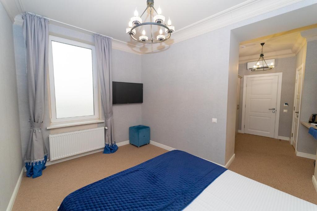 Postel nebo postele na pokoji v ubytování Maner hotel