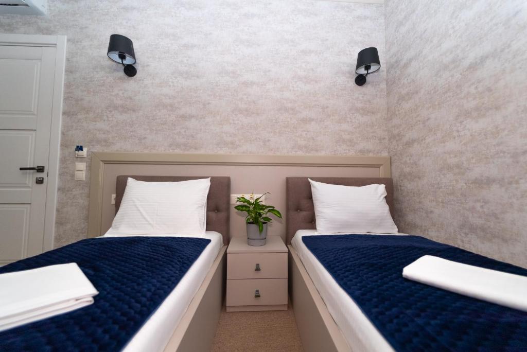 Postel nebo postele na pokoji v ubytování Maner hotel