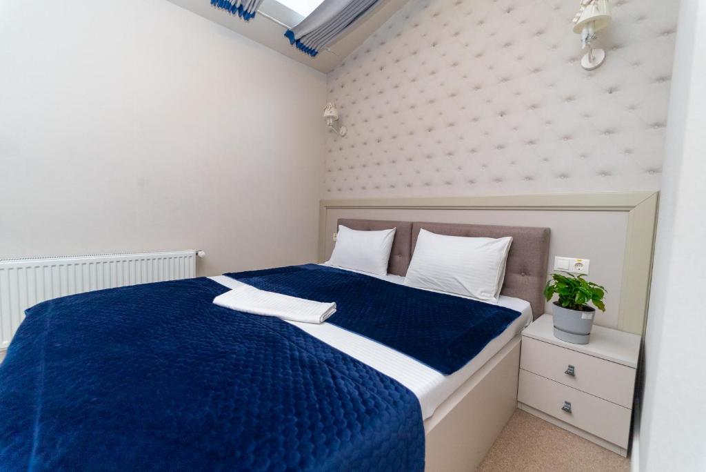 Postel nebo postele na pokoji v ubytování Maner hotel