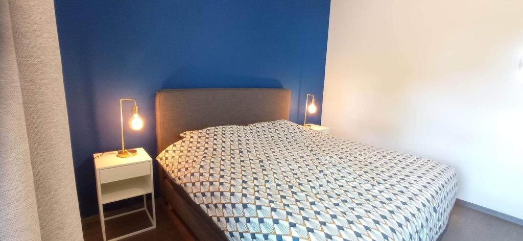 Postel nebo postele na pokoji v ubytování L'appartement du CPW