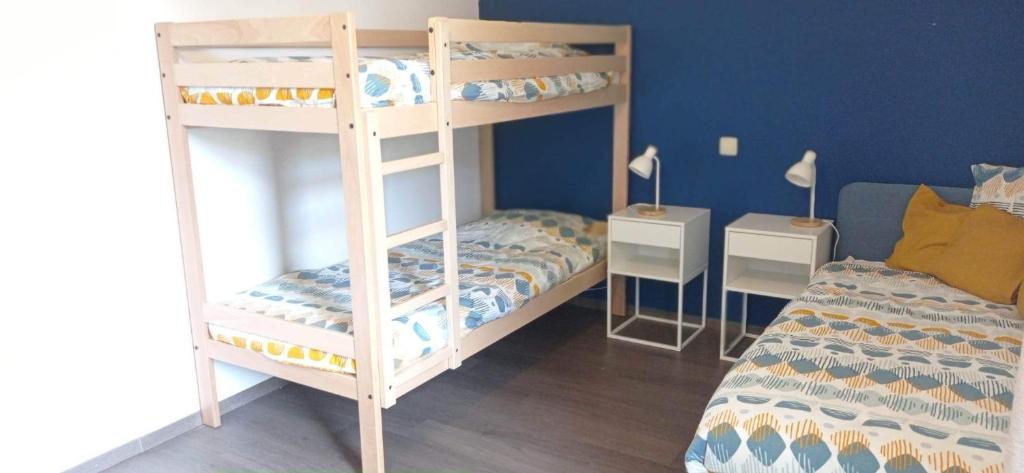 Postel nebo postele na pokoji v ubytování L'appartement du CPW