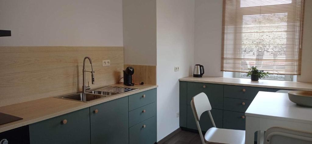 Kuchyň nebo kuchyňský kout v ubytování L'appartement du CPW