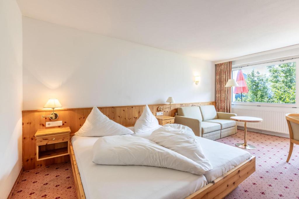 Postel nebo postele na pokoji v ubytování keyone rooms Montafon