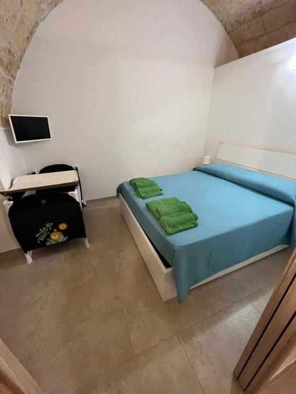Postel nebo postele na pokoji v ubytování lo scrigno di Alice