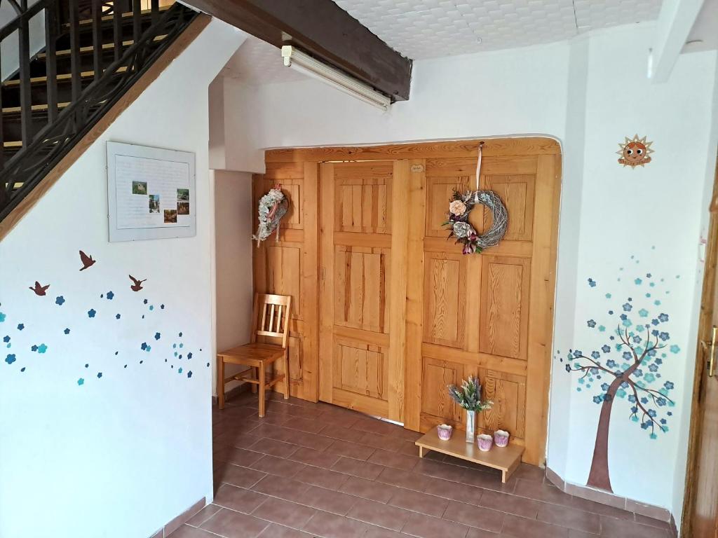 a hallway with a wooden door in a house at Kamélie in Česká Kamenice