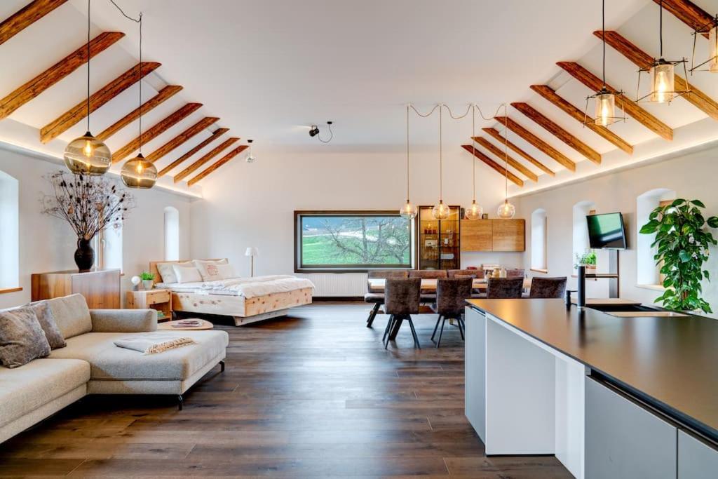 a living room with a couch and a table at außergewöhnliches loft in ehemaligem stallgebäude 