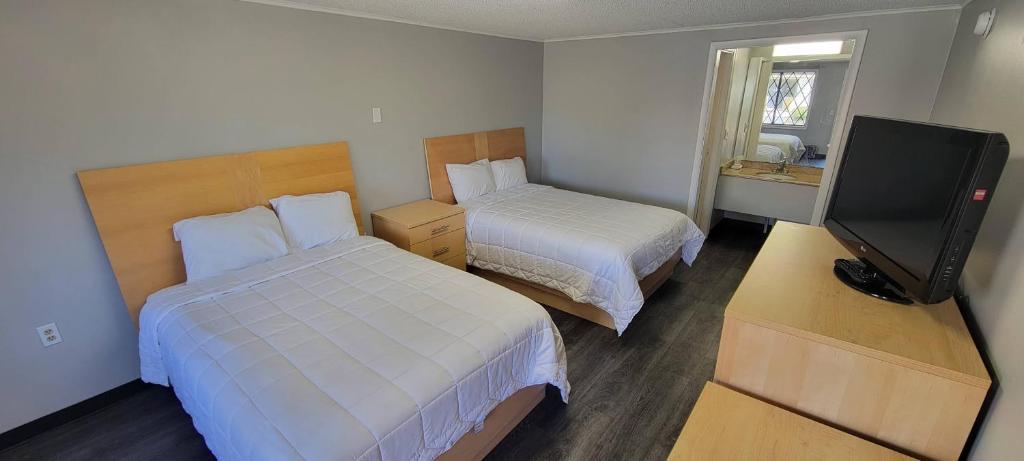 Postel nebo postele na pokoji v ubytování Superlodge