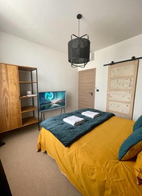 Postel nebo postele na pokoji v ubytování MAISON LE BEAULIEU