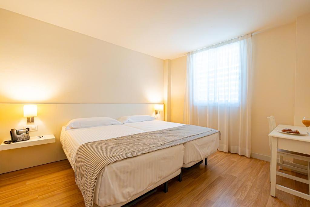 Postel nebo postele na pokoji v ubytování Hotel Rosella affiliated by Intelier