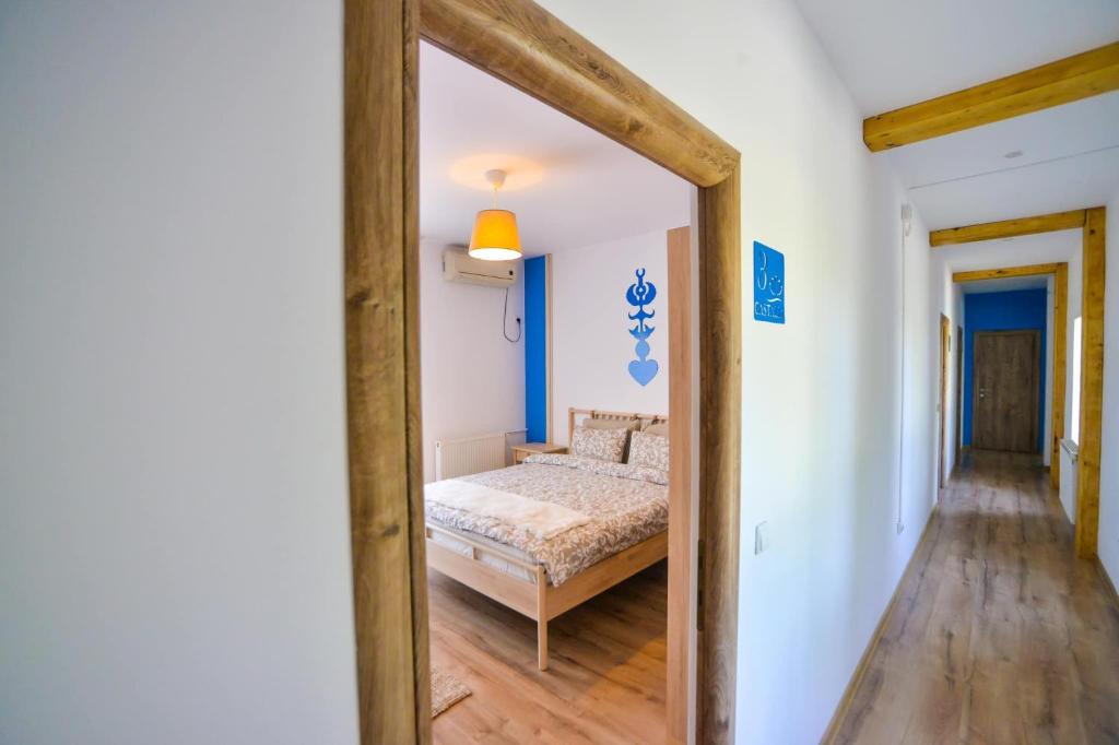 Postel nebo postele na pokoji v ubytování Pensiunea Complex Castalia