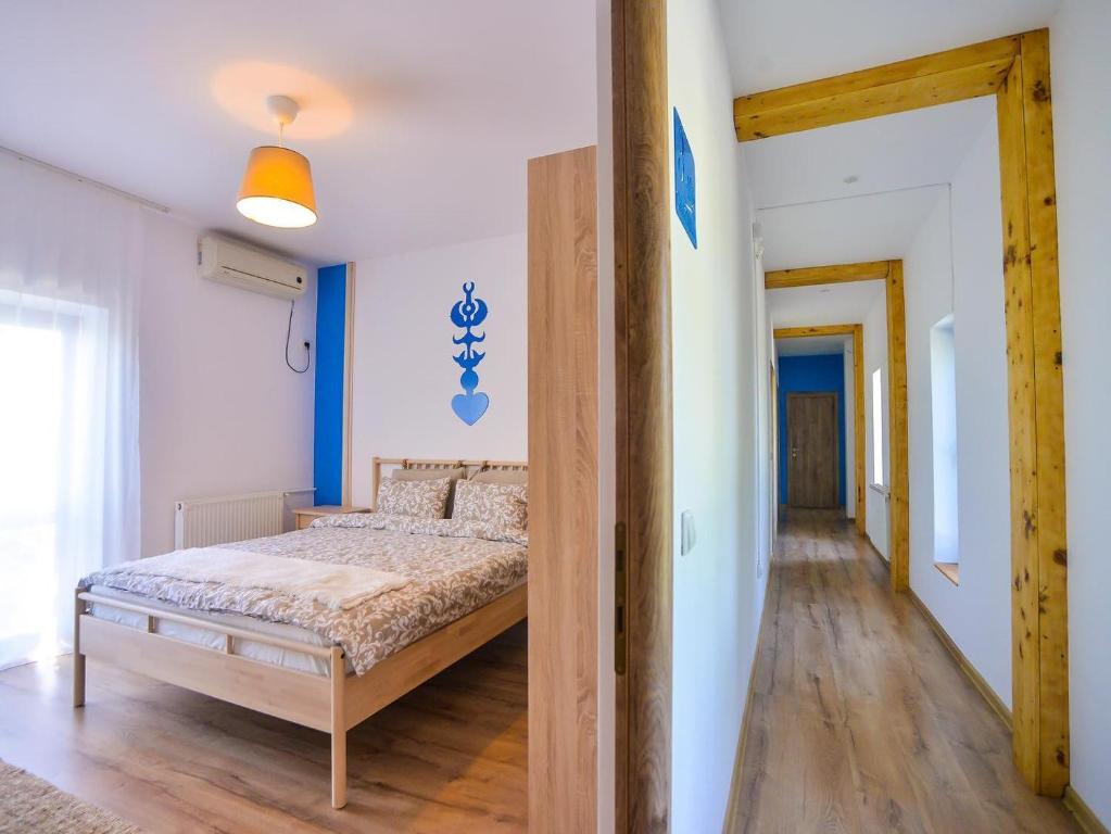 Postel nebo postele na pokoji v ubytování Pensiunea Complex Castalia